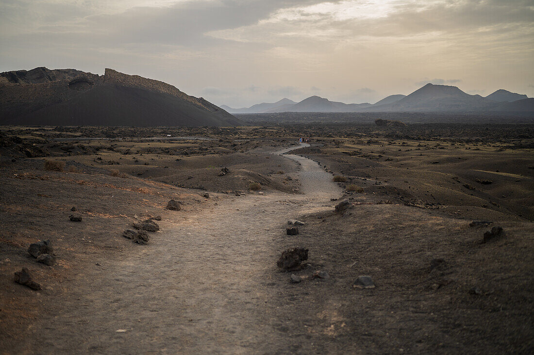 Volcan del Cuervo (Crow volcano) a crater explored by a loop trail in a barren, rock-strewn landscape