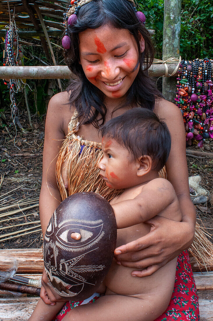 Mother yagua Indians living a traditional life near the Amazonian city of Iquitos, Peru.