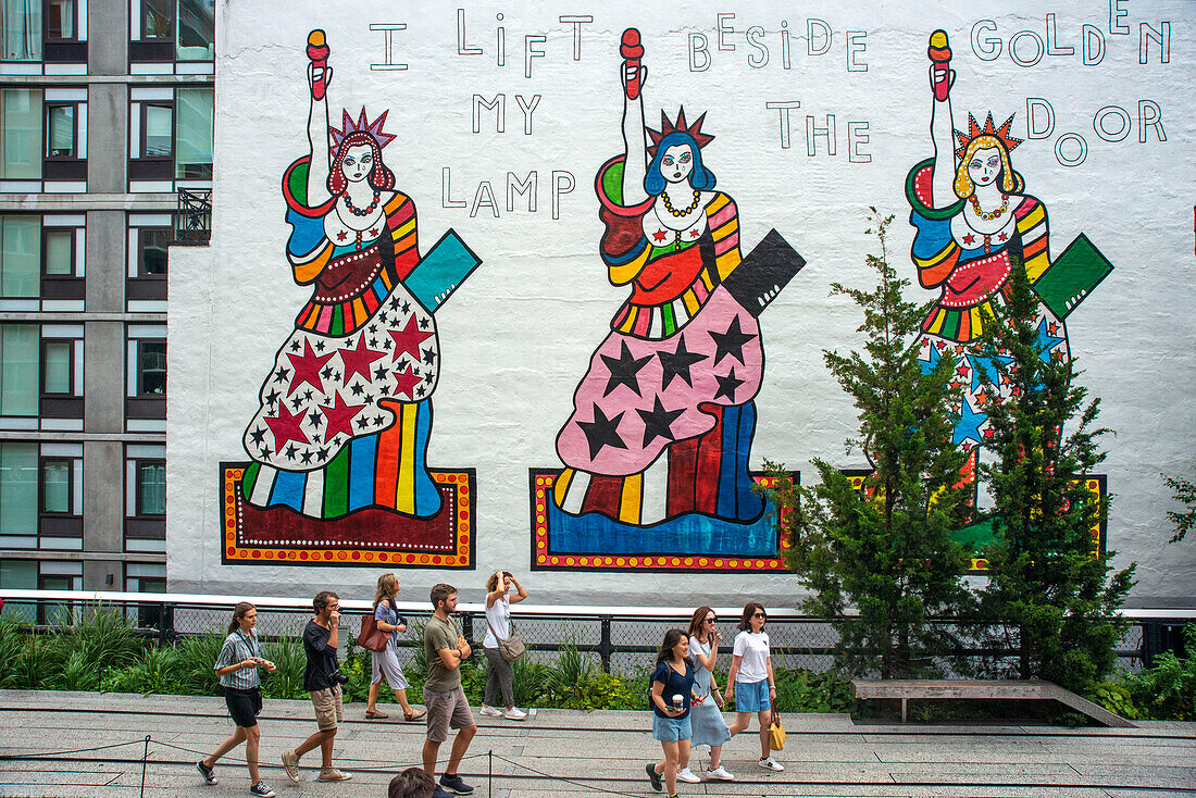 Graffiti of three Statue of Liberty in High Line Elevated Park, elevated linear park, greenway and rail trail in Manhattan in New York City, USA