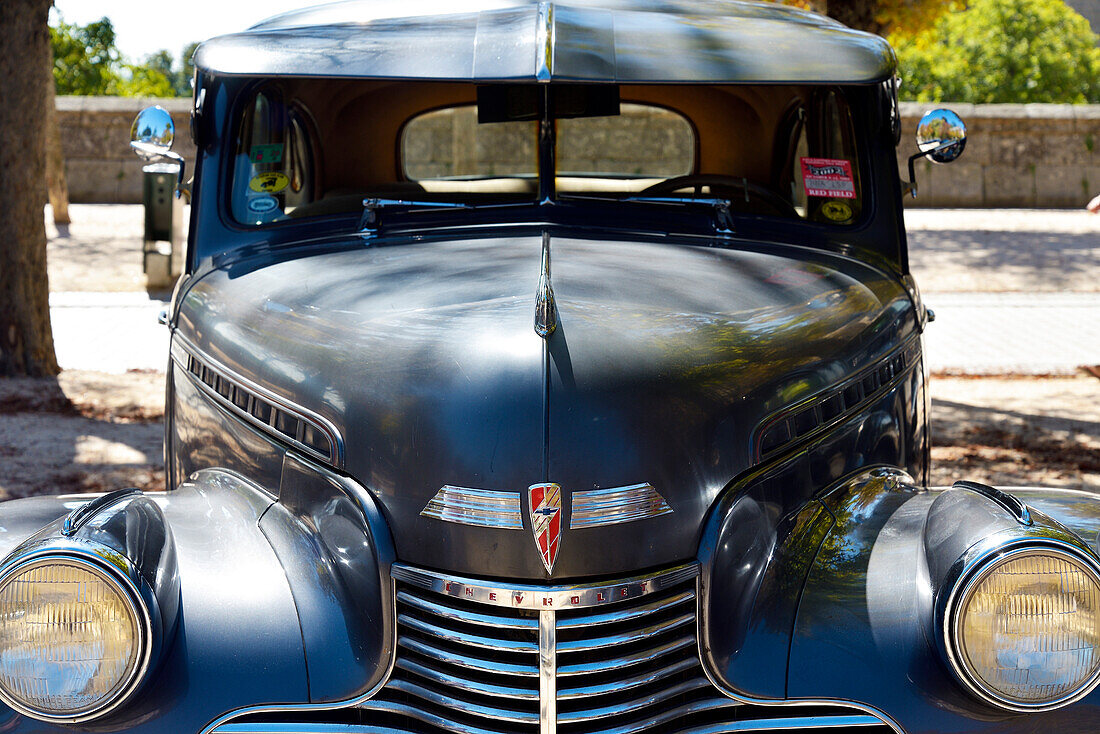 The front of a Chevrolet classic car in a car festival in San Lorenzo de El Escorial, Madrid.