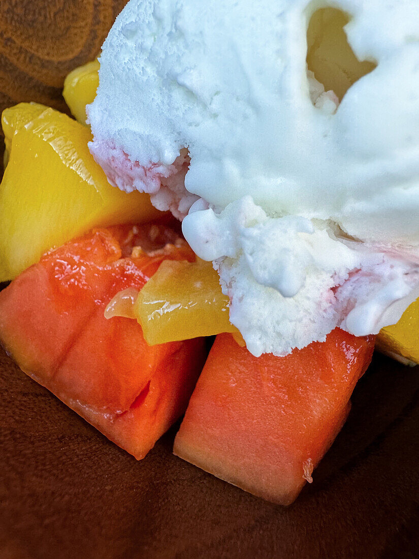 Close up at ice cream dessert with fruit