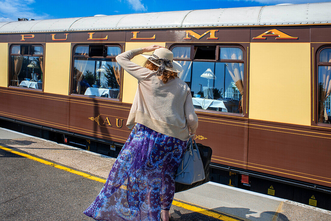 Passengers of Belmond British Pullman luxury train stoped at Folkestone train station railway station in England.