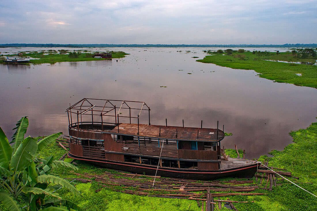 Wooden boats in the Amazon River, Iquitos, Loreto, Peru, South America.