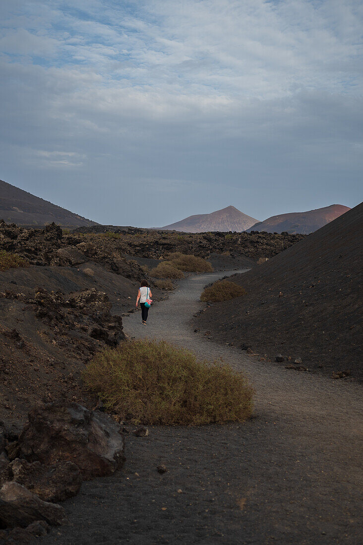 Volcan del Cuervo (Crow volcano) a crater explored by a loop trail in a barren, rock-strewn landscape