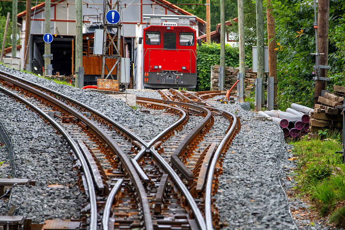 The Petit train de la Rhune rack railway, La Rhun mountain on the border with Spain, France. Train tracks of the historic funicular from 1924 up to the summit of La Rhune Mountain, 905m, Basque Country, Pyrenees