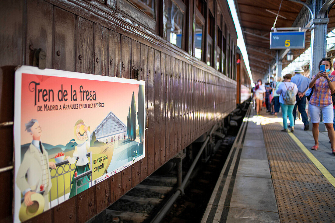 Strawberry train parked at Aranjuez train station, Madrid, Spain. Logo and trade.