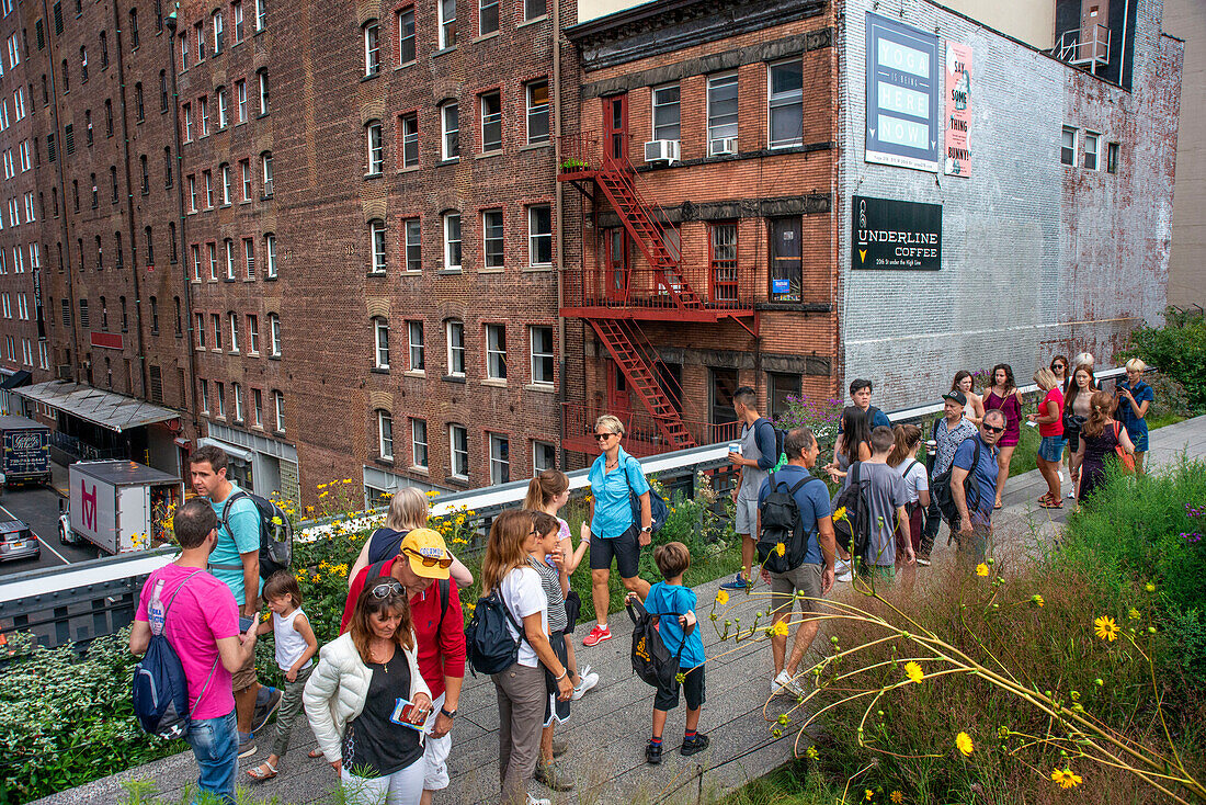 Tourists in the New york high line new urban park formed from an abandoned elevated rail line in Chelsea lower Manhattan New york city HIGHLINE, USA