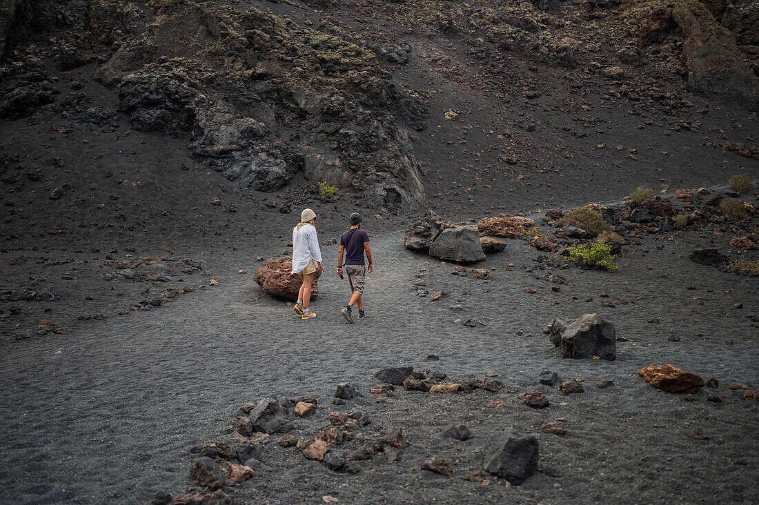 Volcan del Cuervo (Crow volcano) a crater explored by a loop trail in a barren, rock-strewn landscape