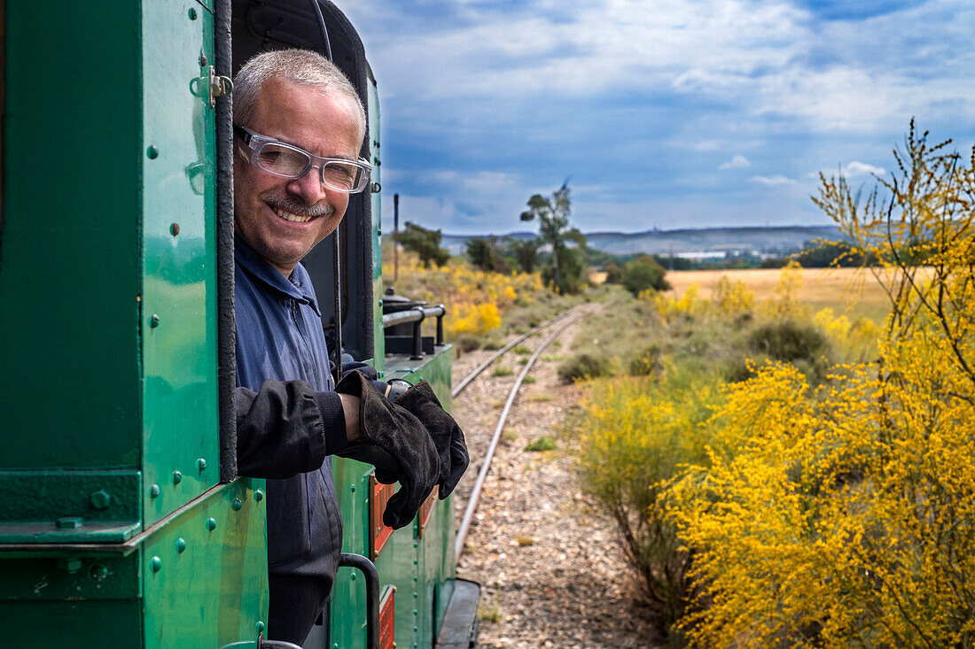 Driver of Aliva nº 4 locomotive in the El Tren de Arganda train or Tren de la Poveda train in in Rivas Vaciamadrid, Madrid, Spain