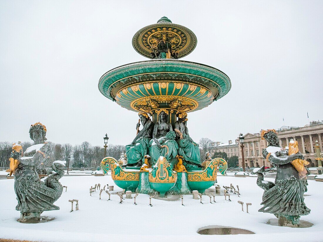 France, Paris, Place de la Concrode, the fountain of the rivers under the snow