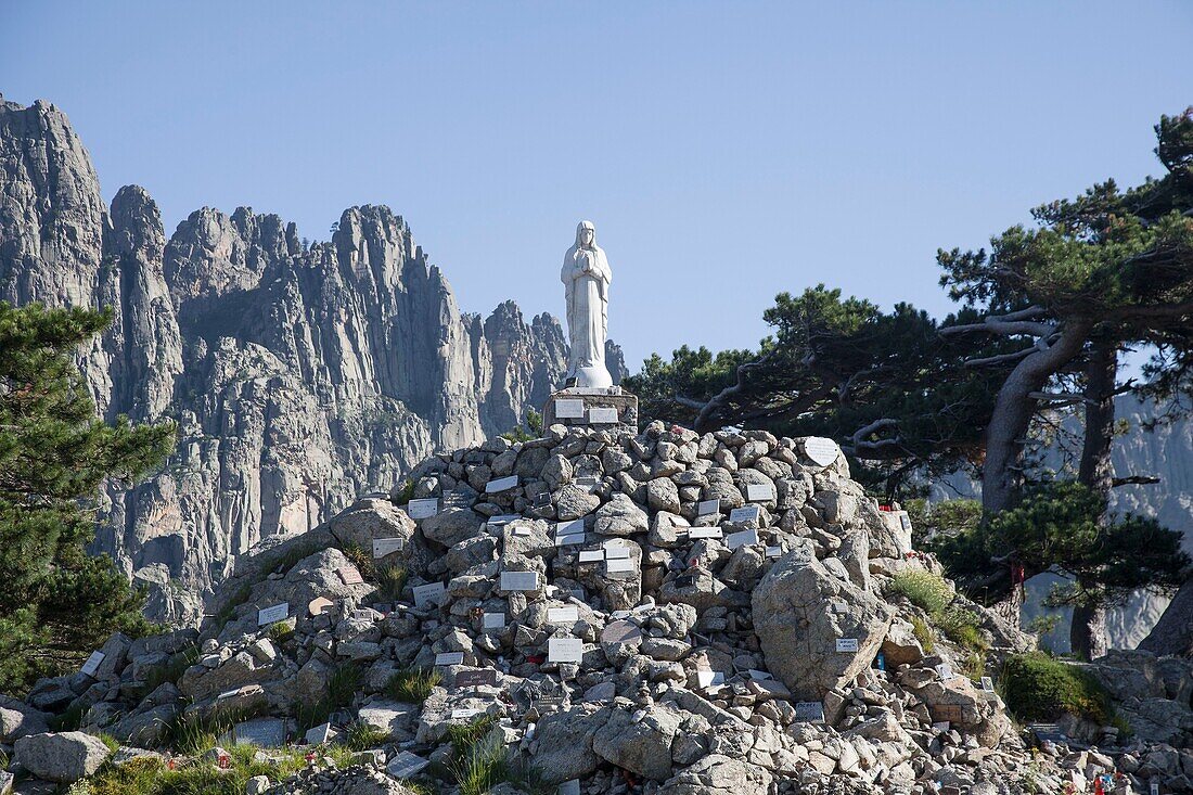 France, Corse du Sud, Quenza, Zonza, Alta Rocca, the statue of Notre Dame des neiges at the Bavella Pass and the Bavella Needles (1855m)