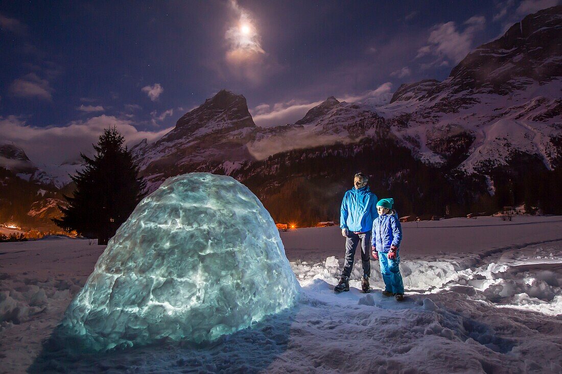 France, Savoie, Massif de la Vanoise, Pralognan La Vanoise, National Park, activity of building an igloo with the family, the night with full moon and tip of the Grand Marchet