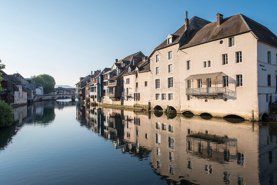 France, Doubs, Loue valley, village of Ornans mirror of Loue, the facades of bourgeois stone houses are reflected in the river