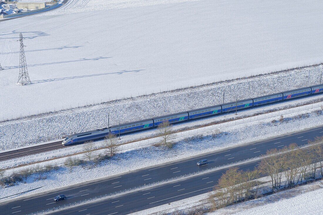 France, Seine et Marne, lines of TGV (HST) and highway A5, in winter (aerial view)