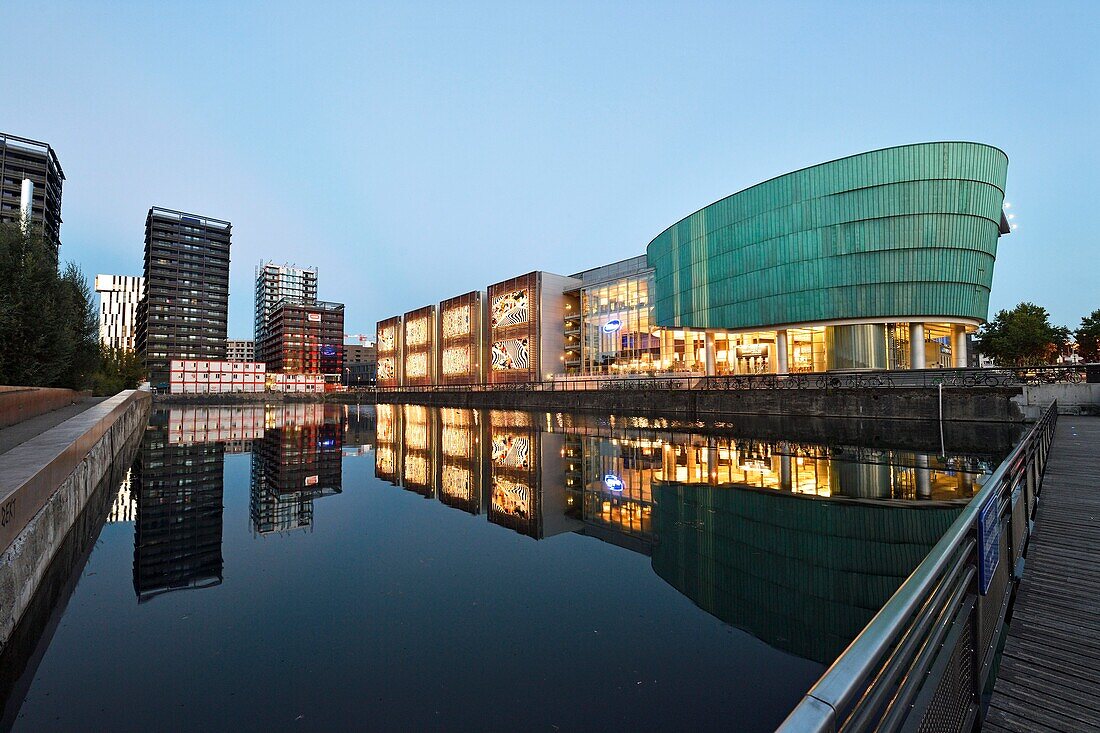 France, Bas Rhin, Strasbourg, development of port du Rhin (Rhine's harbour) and conversion of breakwater of Bassin d'Austerlitz, UGC Cine Cite cinema complex, the 3 Black Swans tower of architect Anne Demians and in the background the Elithis Danube Tower, 1st positive energy tower by XTU Architects