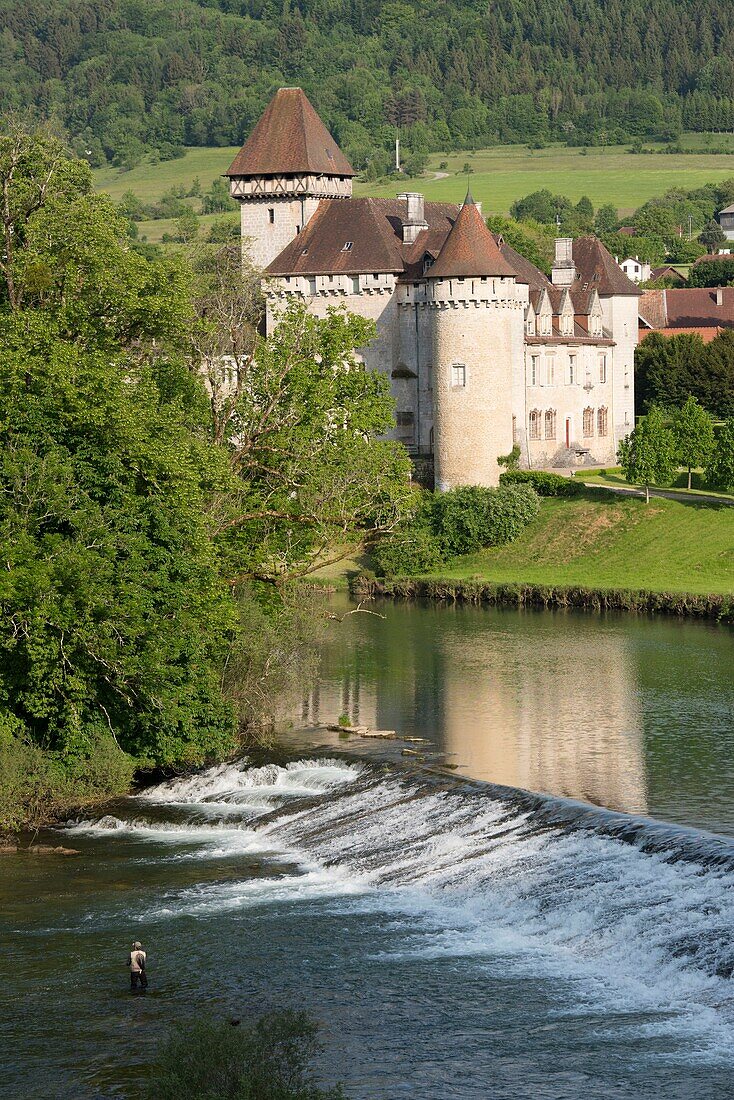 France, Doubs, Loue valley, fisherman in the river in front of Cleron castle