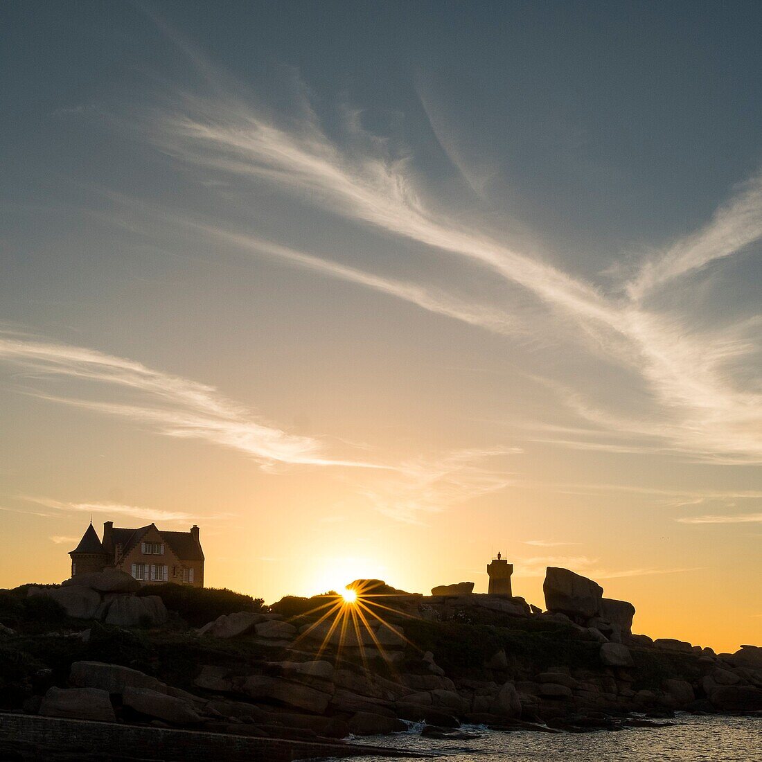 France, Cotes d'Armor, Ploumanach, Perros-Guirec, Pink granite coast, the lighthouse of Ploumanac'h or lighthouse of Mean Ruz at sunset on the footpath of Customs or GR Grande 34 hiking trail