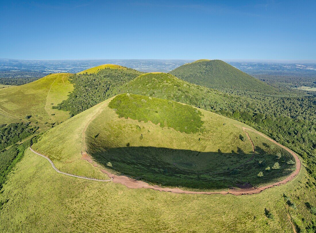 France, Puy de Dome, Orcines, Regional Natural Park of the Auvergne Volcanoes, the Chaîne des Puys, listed as World Heritage by UNESCO, Puy Pariou volcano in the foreground (aerial view)