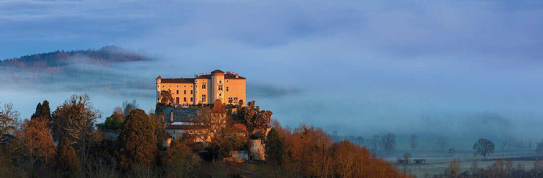 France, Pyrenees, Ariege, Prat-Bonrepaux, view of a castle on a promontory above a valley in the morning mist