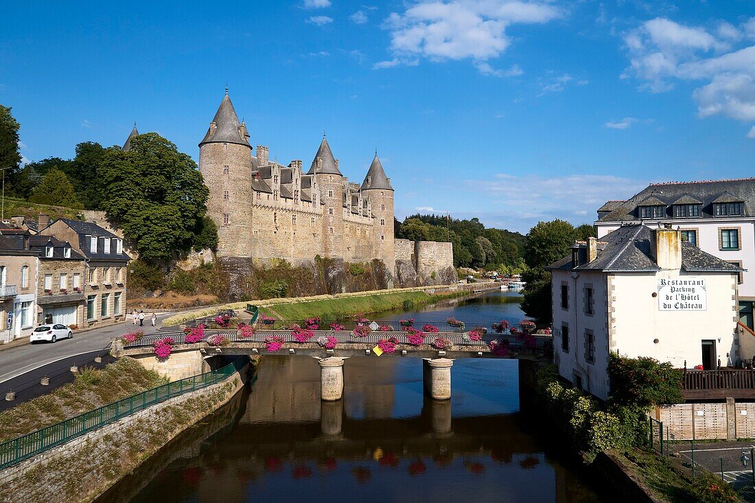 France, Morbihan, stop on the Way of St James, Josselin, medieval village, Josselin castle in flaming gothic style on the Oust River banks (aerial view)
