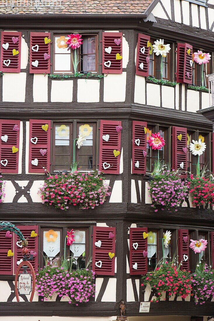 France, Haut Rhin, Route des Vins d'Alsace, Colmar, facade of a traditional house hosting the shop Aux Vieux Pignons located in Marchands Street
