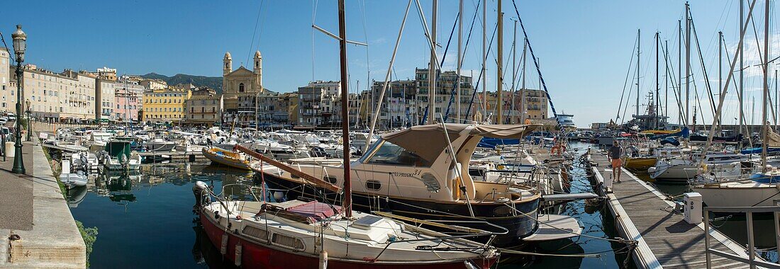 France, Haute Corse, Bastia, panorama of the old port, the pleasure boats and the facade of the church Saint Jean Baptiste