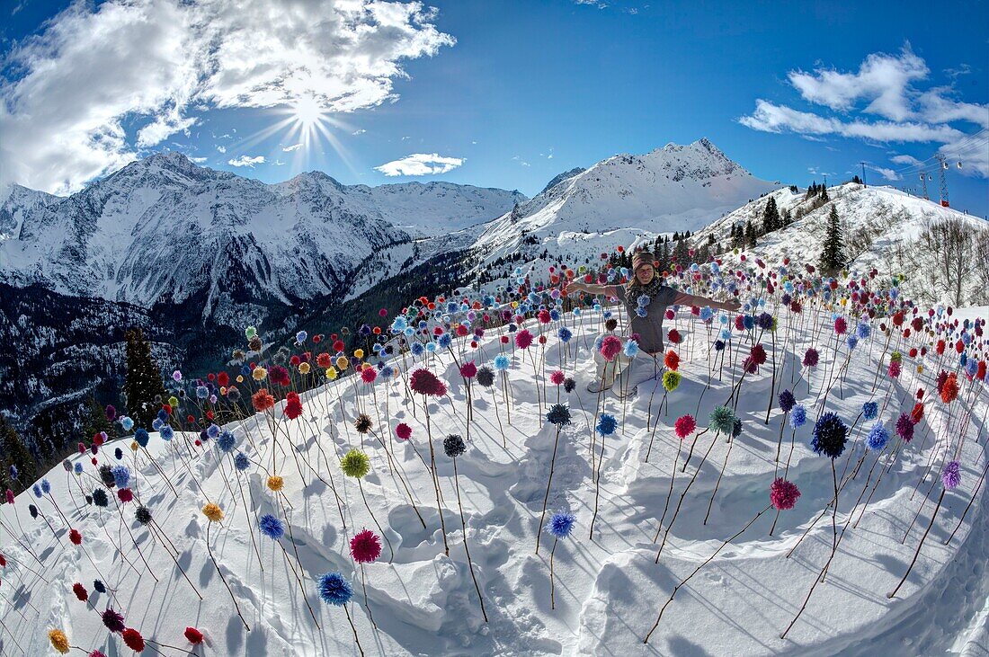 France, Haute Savoie, Massif of the Mont Blanc, the Contamines Montjoie, Land art on the tracks of the ski area, the installation of Niki Heddle's woolen flowers