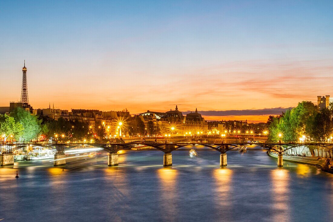 France, Paris, Seine river banks listed as World Heritage by UNESCO, a fly boat, the Arts footbridge and the Eiffel Tower