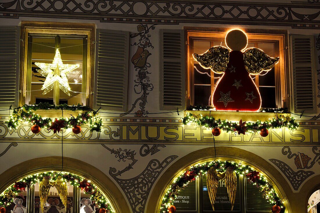 France, Haut Rhin, Colmar, Rue des Tetes, Hansi museum, during the Christmas market, illuminations