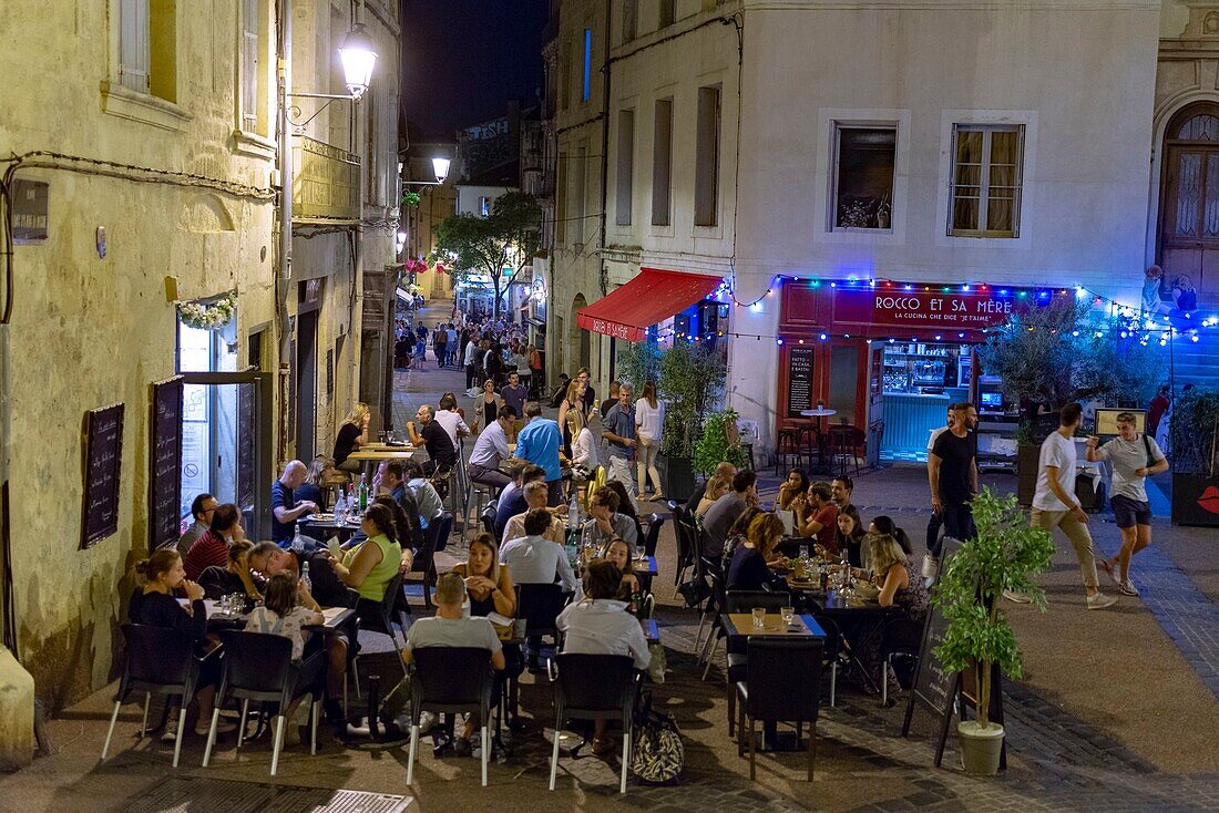 France, Herault, Montpellier, District of Saint Roch, terraces of restaurant on a place at night