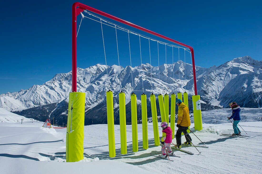 France, Haute Savoie, Massif of the Mont Blanc, the Contamines Montjoie, on the ski slopes in family in the ludo park and the highest summit of Europe,