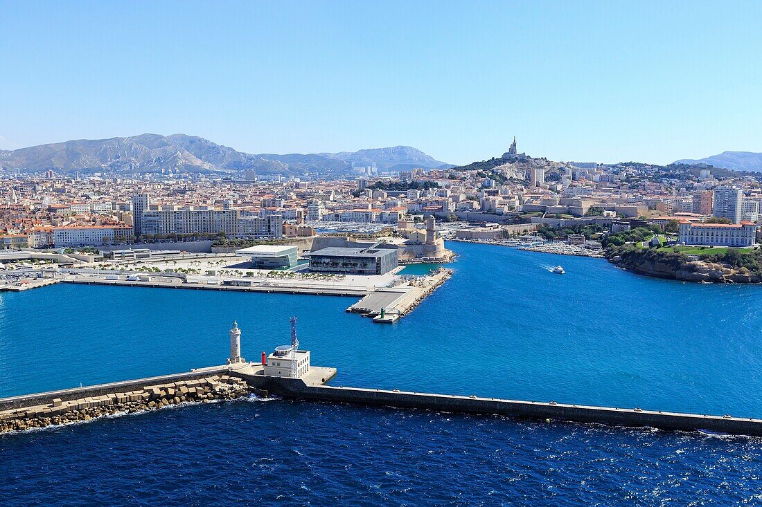 France, Bouches du Rhone, Marseille, Euroméditerranée area, Esplanade J4, entrance to the Vieux Port, Palais du Pharo, Dyke du Large, pier Jean Charcot, lighthouse Sainte Marie, basilica Notre Dame de la Garde in the background (aerial view )