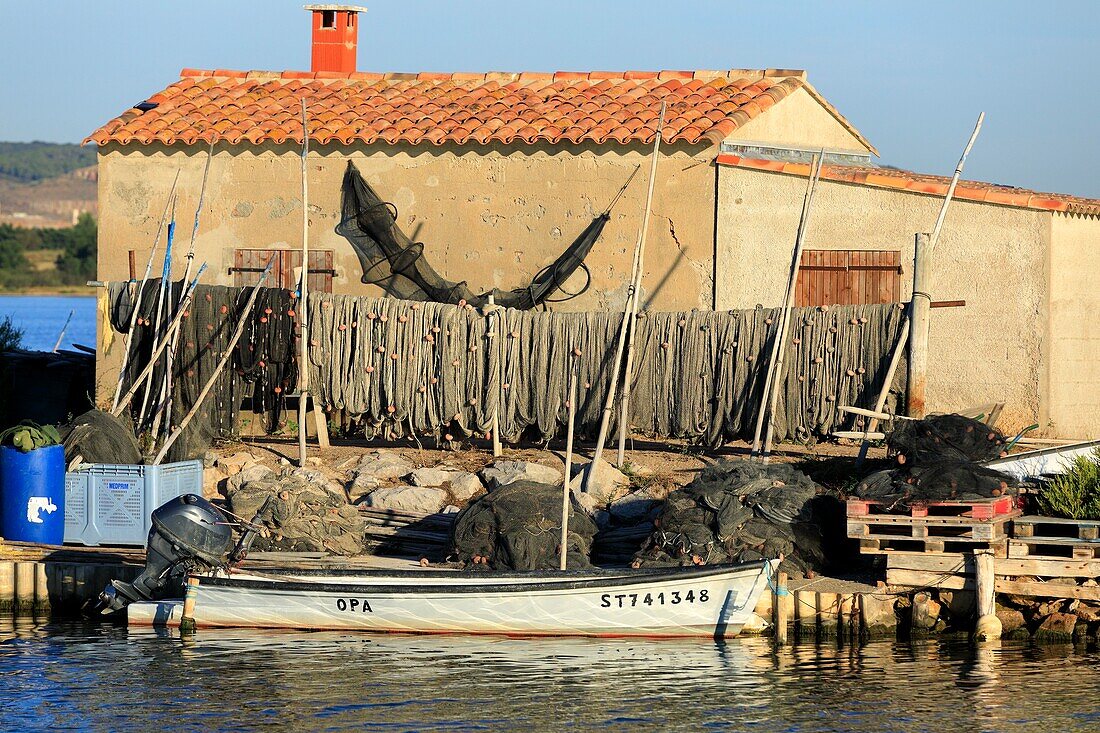 France, Herault, Villeneuve les Maguelone, Cabins of Mas Neuf, Canal du Rhone in Sete, fishing nets