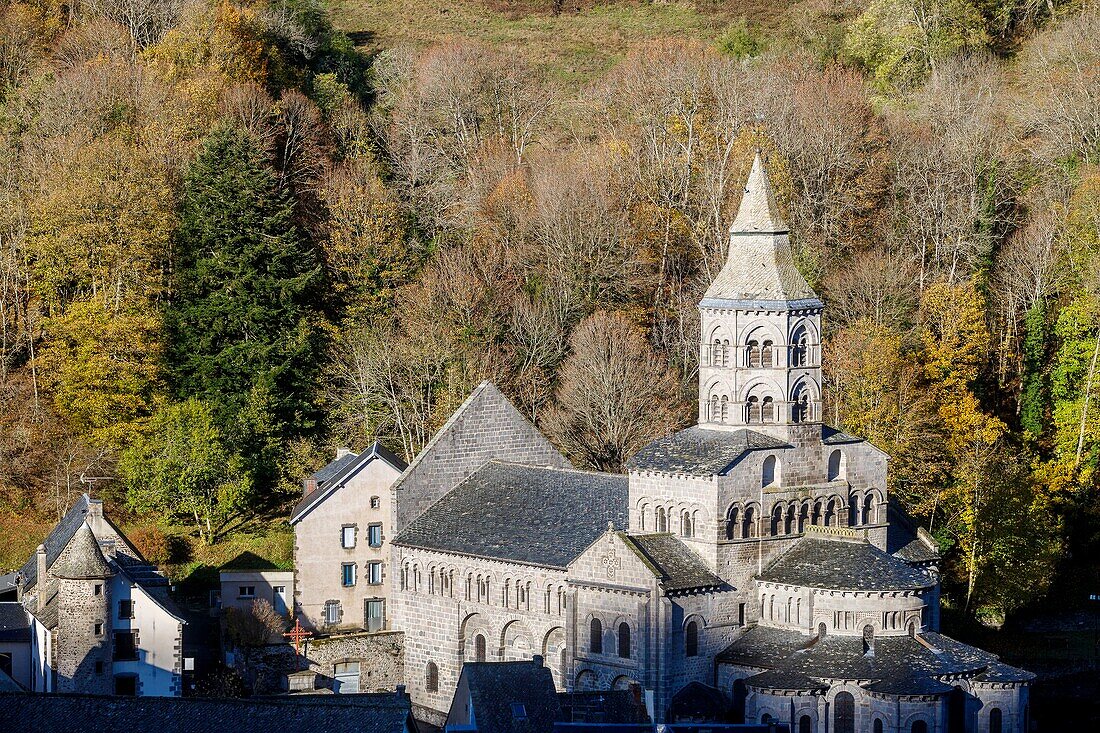 France, Puy de Dome, Volcans d'Auvergne Regional Nature Park, Dore Mountains, Orcival, 12th century Notre Dame d'Orcival basilica and its two storey octagonal bell tower