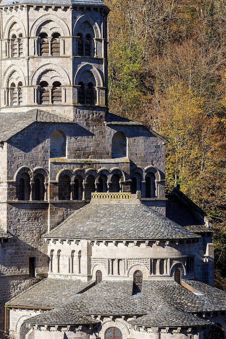 France, Puy de Dome, Volcans d'Auvergne Regional Nature Park, Dore Mountains, Orcival, 12th century Notre Dame d'Orcival basilica and its two storey octagonal bell tower