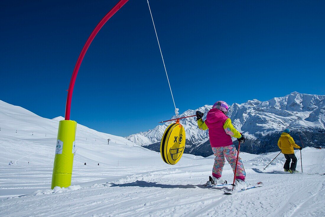 France, Haute Savoie, Massif of the Mont Blanc, the Contamines Montjoie, on the ski slopes in family in the ludo park and the highest summit of Europe,