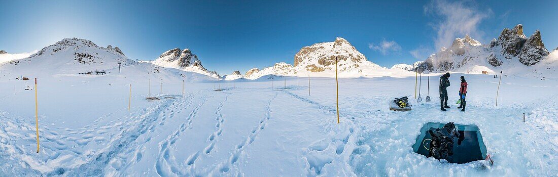 France, Isère (38), Belledonne, Chamrousse, panoramic view of lakes Robert bordered and dominated on the east by Petit Van (2,439 meters), Grand Van (2,448 meters) and Grand Sorbier (2,526 meters) , where a team of divers has just come out from under the ice - Dive Xtreme