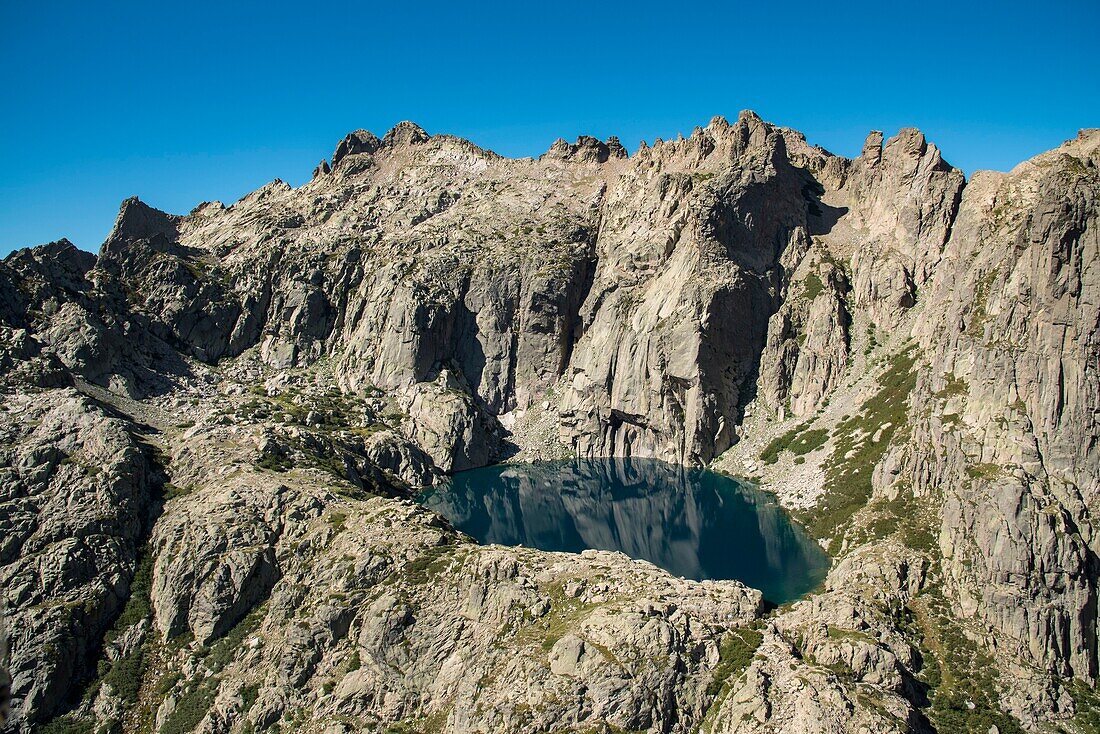 France, Haute Corse, Corte, Restonica Valley, Regional Nature Park panorama on Capitello lake and the tip of 7 lakes (aerial view)