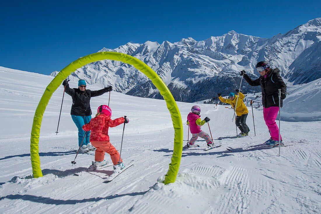 France, Haute Savoie, Massif of the Mont Blanc, the Contamines Montjoie, on the ski slopes in family in the ludo park and the highest summit of Europe,