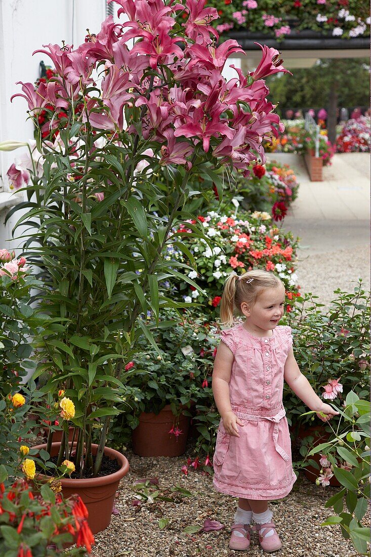 Girl beside tree lilies