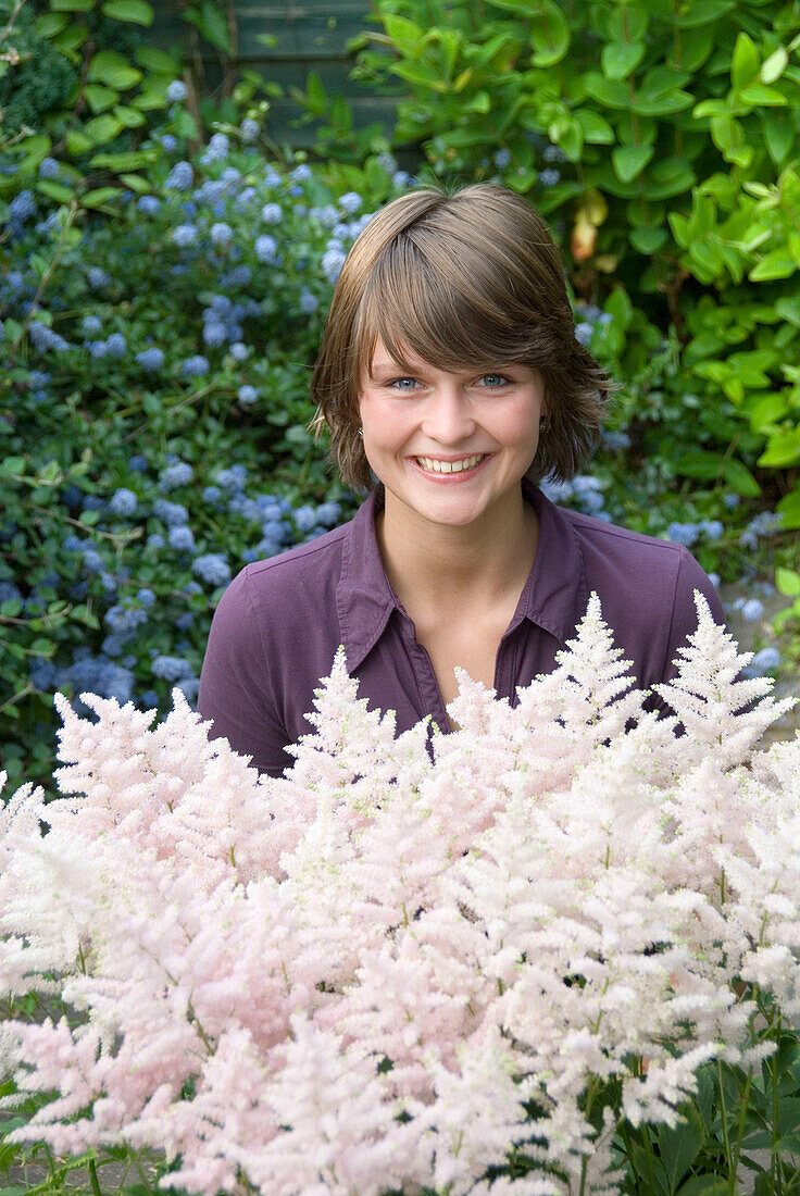 Woman holding Astilbe