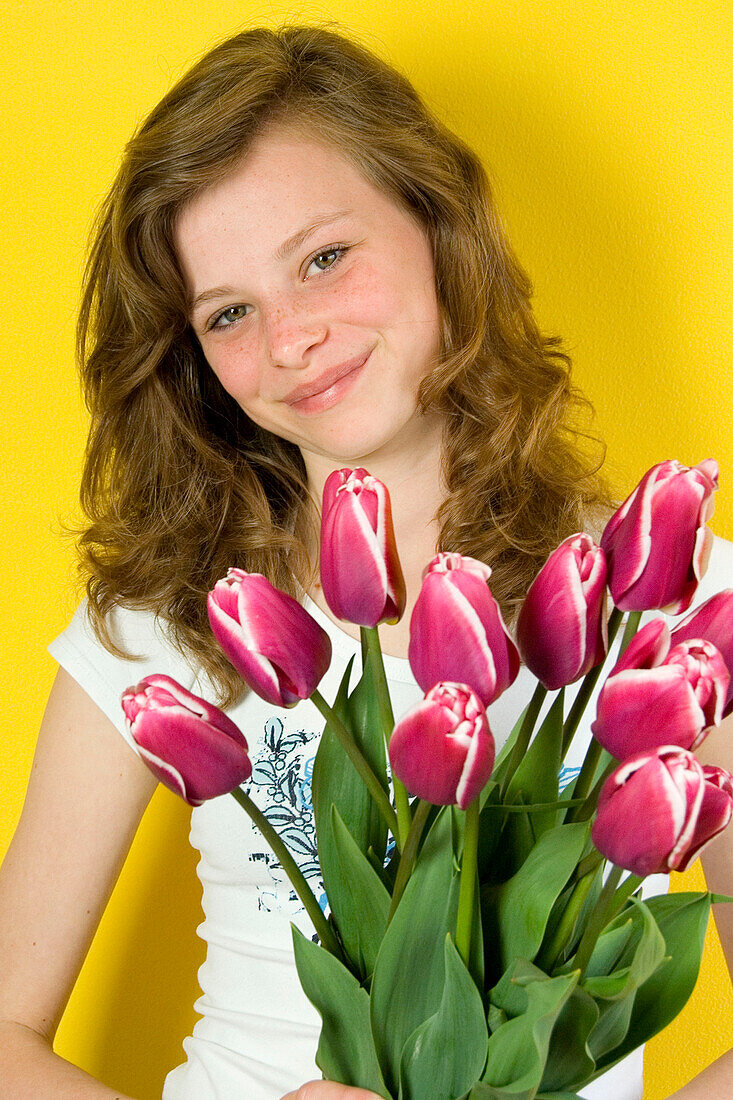 Girl holding tulips