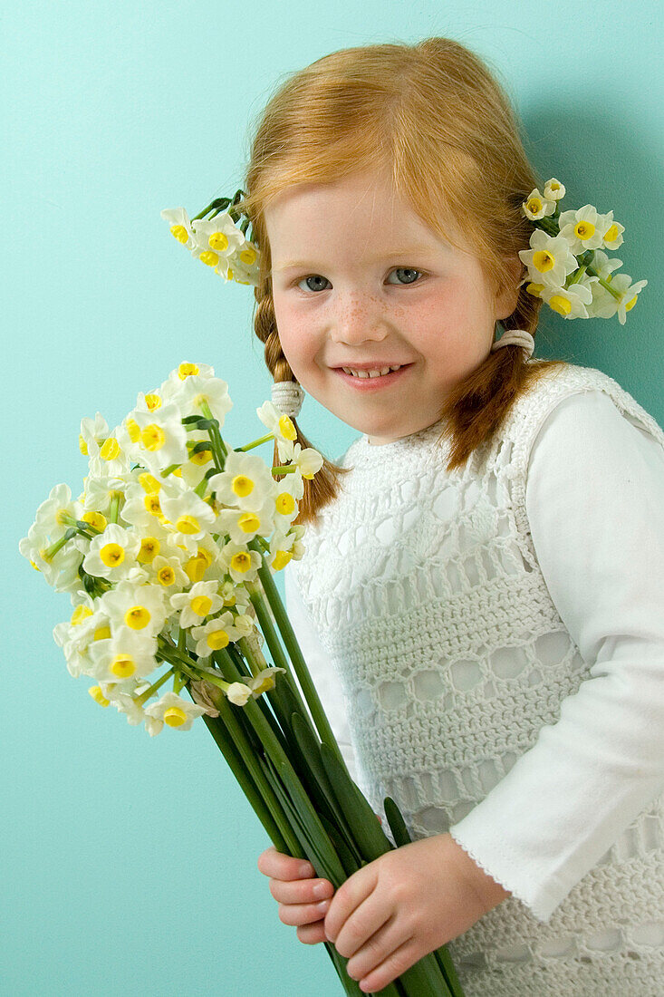 Girl holding daffodils