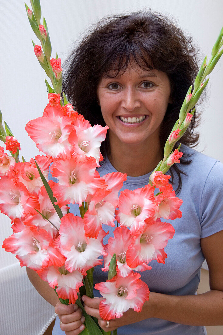 Woman holding Gladiolus