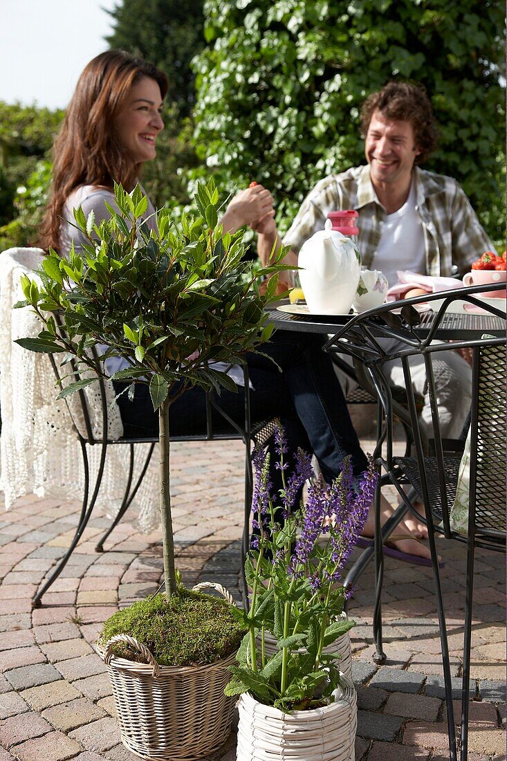 Couple sitting in garden