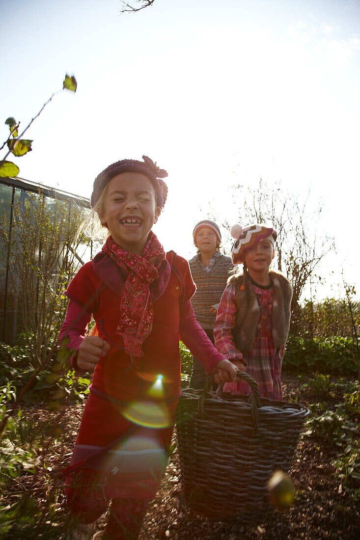 Children carrying basket