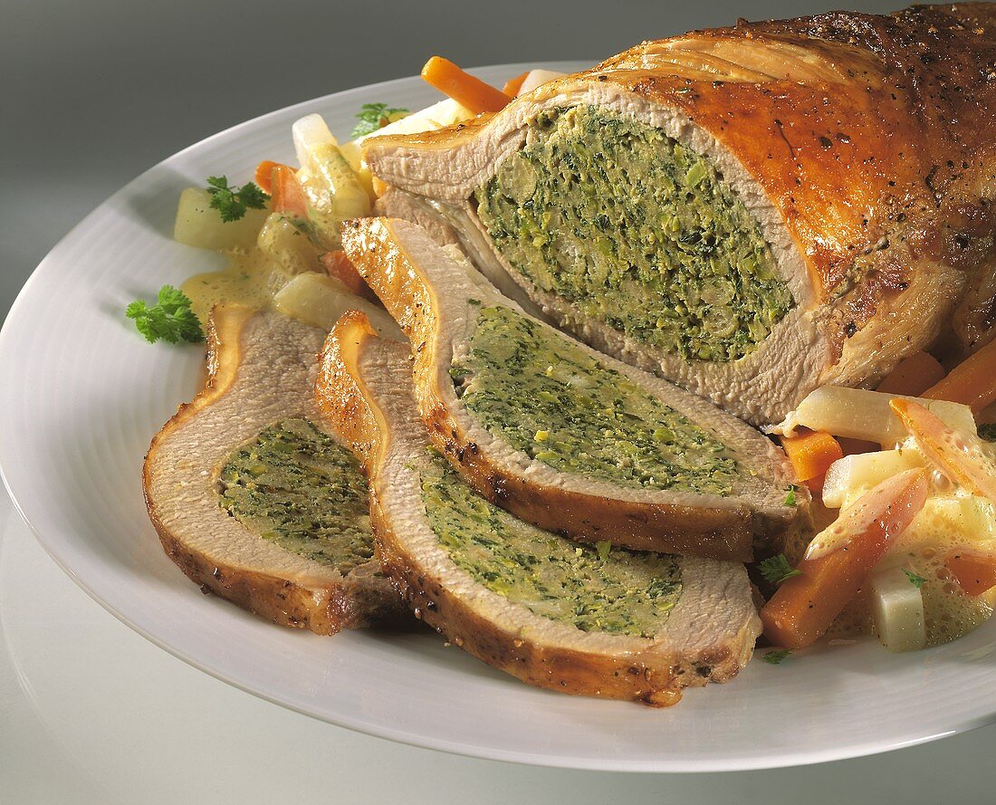Roast pork with savoy & bread stuffing & vegetables