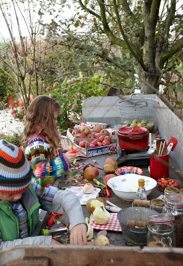 Children peeling apples