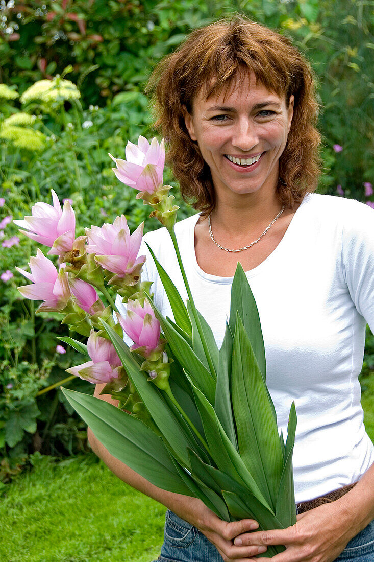 Woman holding Curcuma