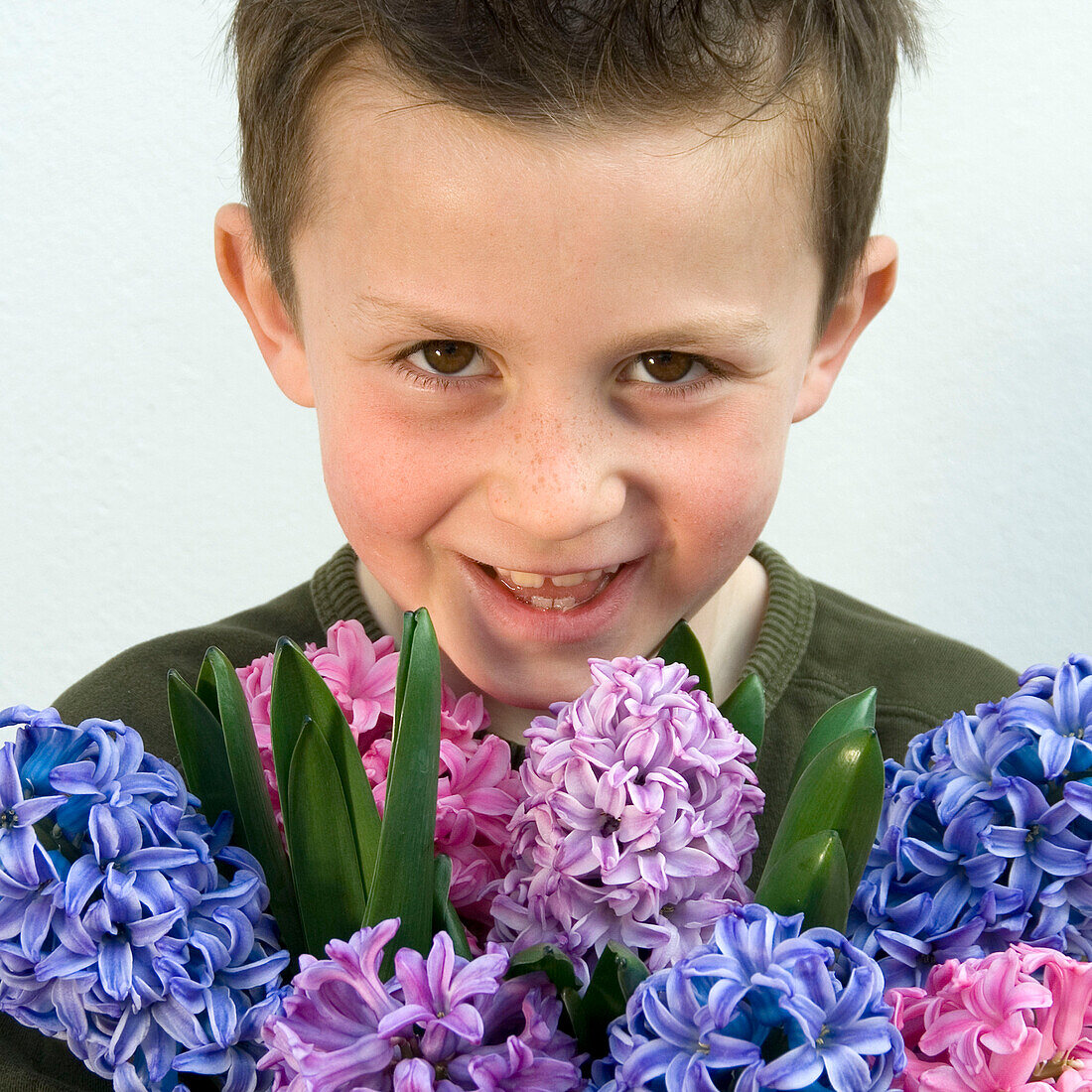 Boy holding hyacinths